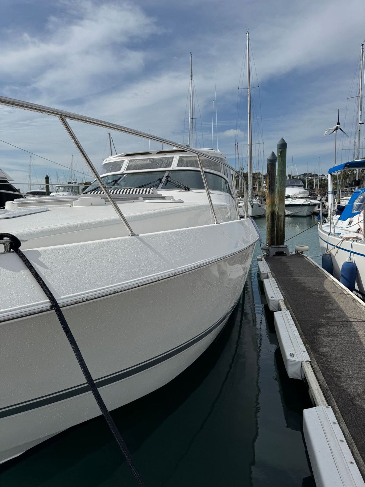 Freshly washed white bow at a marina berth